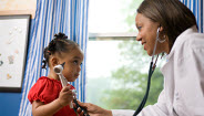 Doctor checking childs heartbeat Doctor checking childs heartbeat