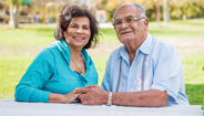 An elderly couple holding hands An elderly couple holding hands