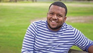 Man sitting on a bench smiling