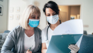Patient and doctor reviewing test results together.