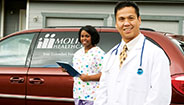 Doctor and nurse in front of Molina van